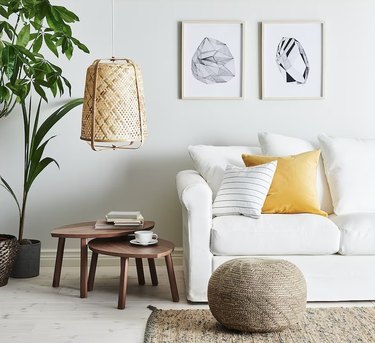 ikea living room with white sofa and jute rug
