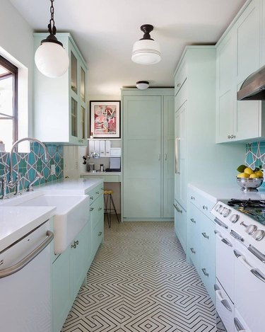 mint green kitchen with teal tile backsplash
