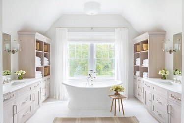 white bathroom with wall to wall cabinets