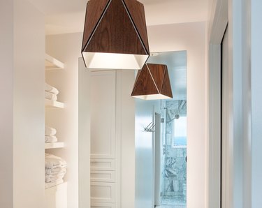 Wood pendant lights in bathroom.