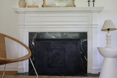 DIY summer cover inserted into fireplace opening