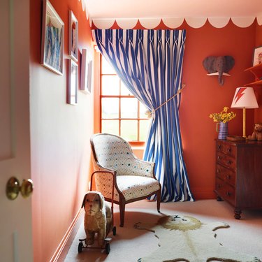 carnival-themed kids' room with scalloped wall paint