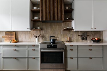 Semihandmade kitchen with white and grey cabinets with oven