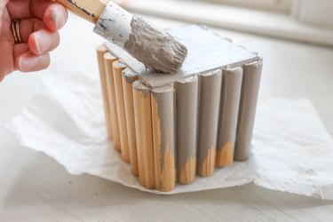 Painting fluted cube riser with gray paint