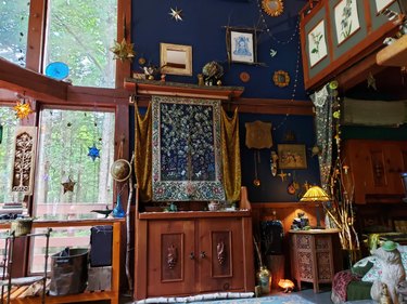 living room with large windows and celestial motifs