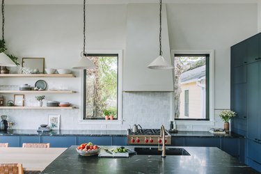 Semihandmade kitchen with white walls and blue cabinets