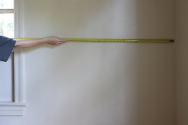 Measuring width of the wall with a tape measure