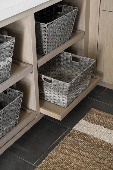 blanket storage ideas baskets on pull-out shelves