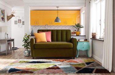 green sofa with mattress pullout