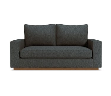 gray sofa with wooden base