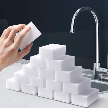 pyramid of melamine sponges in front of sink