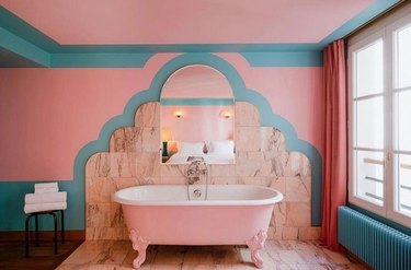 White clawfoot tub in pastel bathroom