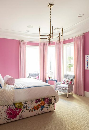 bedroom with pink walls and curtains
