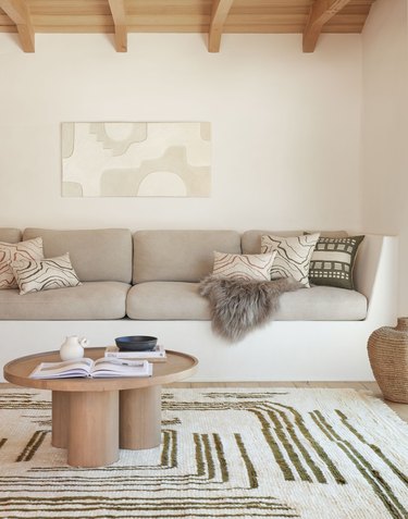 neutral living room with organic-patterned rug