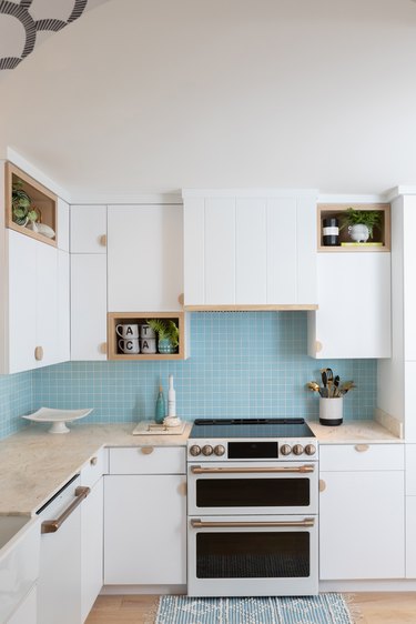 Sky blue backsplash with white kitchen cabinets