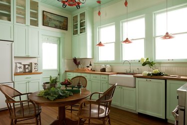 mint green kitchen with red vintage lighting