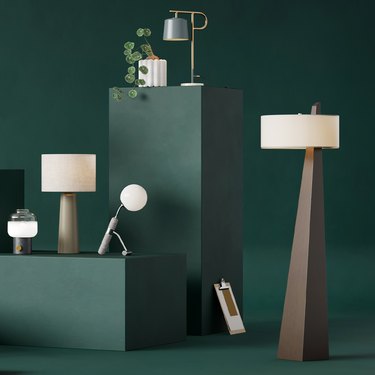 modern looking floor lamps and desk lamps on green background