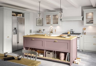 Cool white kitchen with mauvey pink island