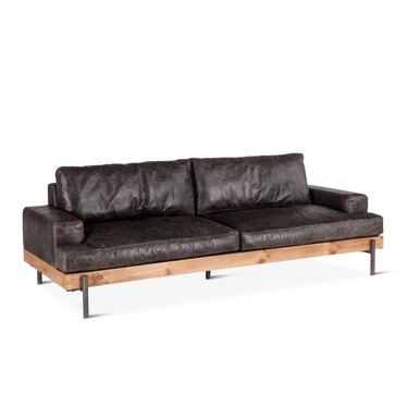 Industrial dark leather couch with wood