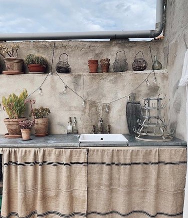 rustic outdoor kitchen with skirt