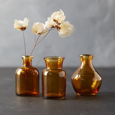 three bottle bud vases in amber hue