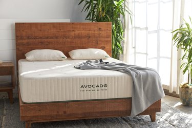 Avocado eco organic mattress on wood bed frame