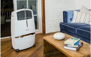 Portable indoor evaporative cooler in blue and white living room