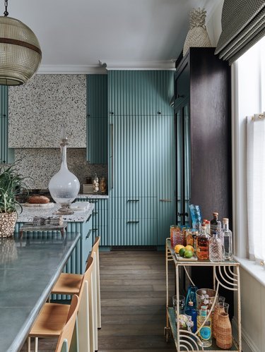 modern kitchen with blue reeded cabinets