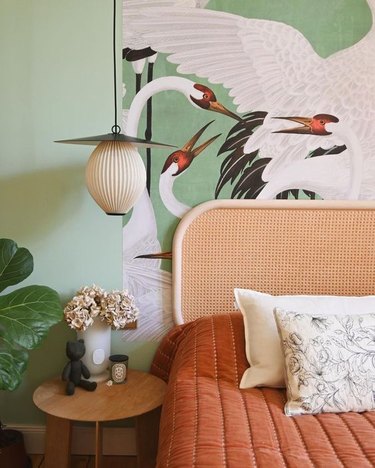 mint green walls with Gucci Heron wallpaper accent wall