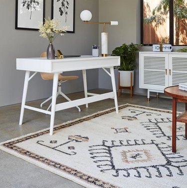 square area rug with white desk
