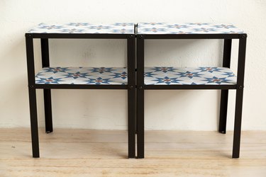 Two tables side by side with patterned tiles