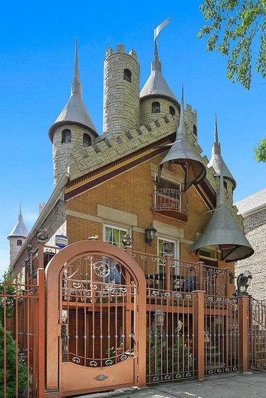 Exterior of a castle house with orange gate