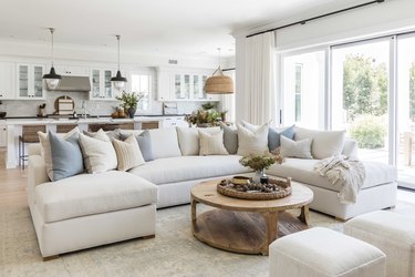 Creme colored couch in a coastal style living room