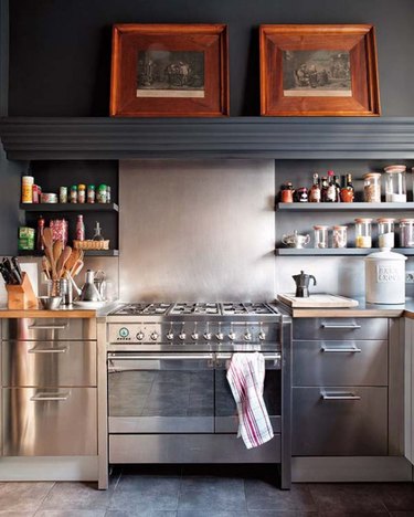dark gray kitchen with stainless steel cabinets and matching stove