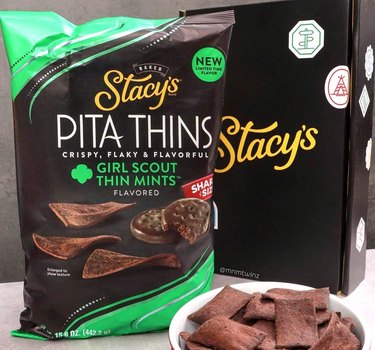 Bag of Stacy's Pita Thins in Girl Scout Thin Mints flavor next to a bowl full of the chocolate crisps