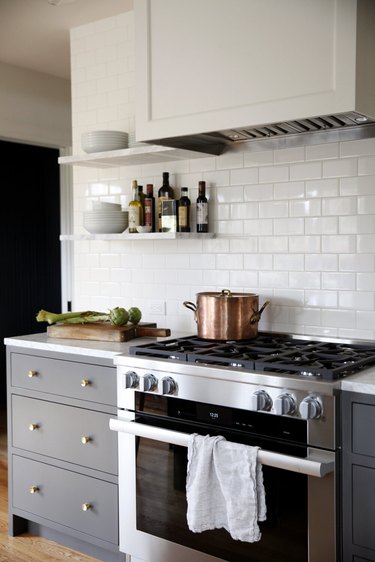 minimalist gray kitchen with white subway tile