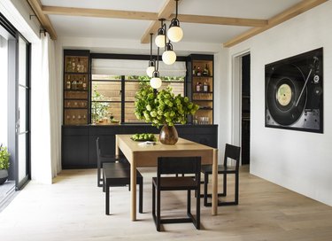 Black dining room chairs and wood table in dining area