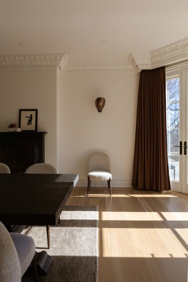 dining room with beige walls and brown curtains