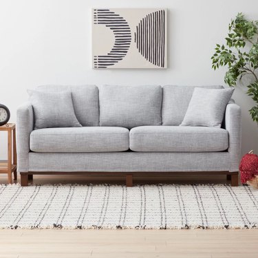gray sofa with wooden accents