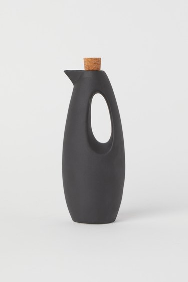 black stoneware oil bottle with cork