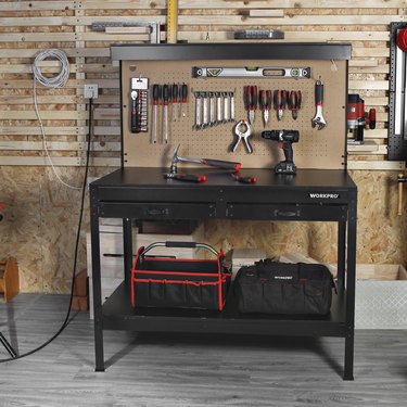 black workbench with light and pegboard