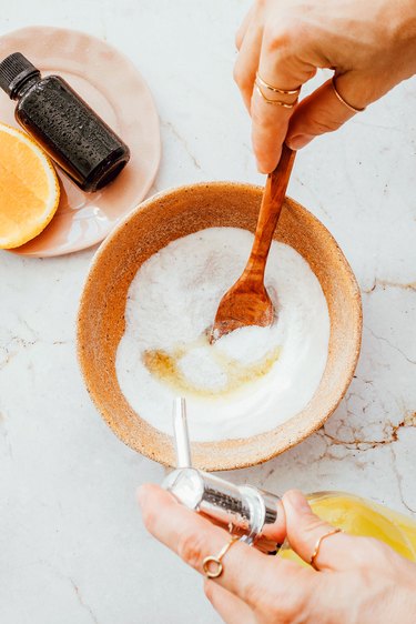 Stir soap into baking soda and salt for a DIY bathtub scrub