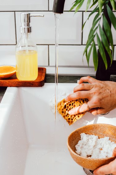 Use baking soda scrub to clean bathtubs and sinks