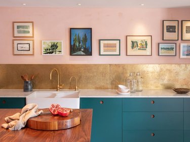 blue and pink kitchen with hammered gold backsplash