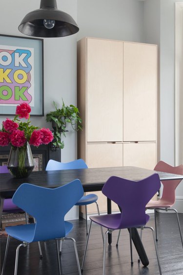 dining room with modern pastel chairs