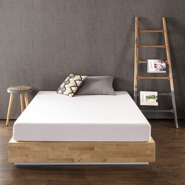 memory foam mattress on wooden bed frame