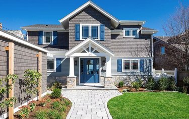 gray shingled home with navy accents