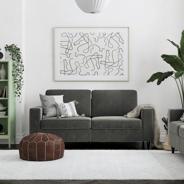 Grey velvet couch in living room