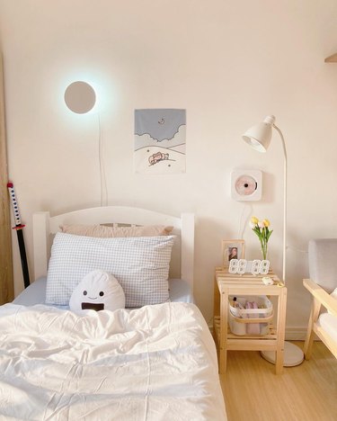 bedroom with onigiri plush on bed