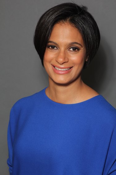 photo of a person with short black hair and a blue shirt